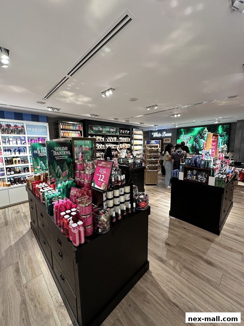 Interior view of a Bath & Body Works store showcasing various body care products and holiday displays.