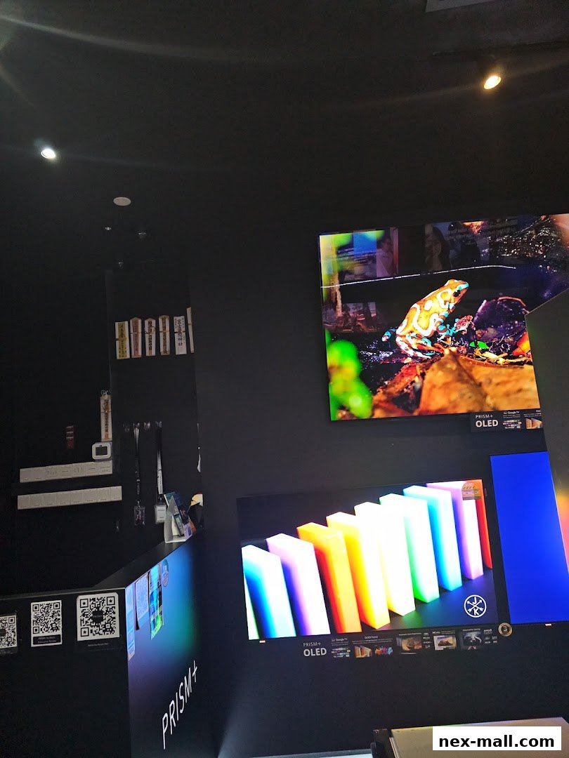 PRISM+ OLED TVs displaying vibrant images of a frog and colorful bars.