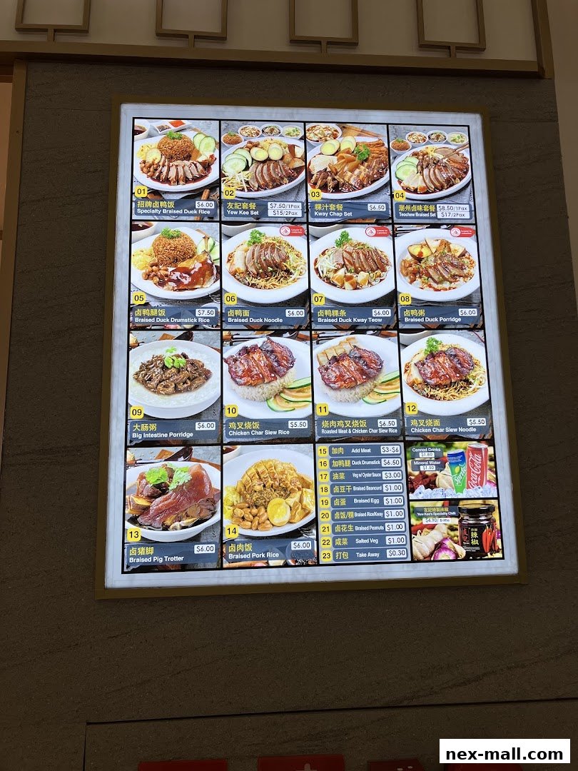 A brightly lit menu board displaying various duck and rice dishes with prices.