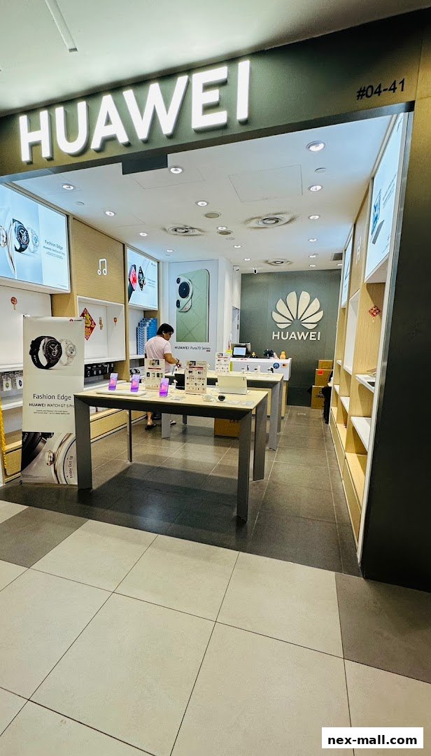 Interior view of a Huawei Concept Store showcasing products and branding.