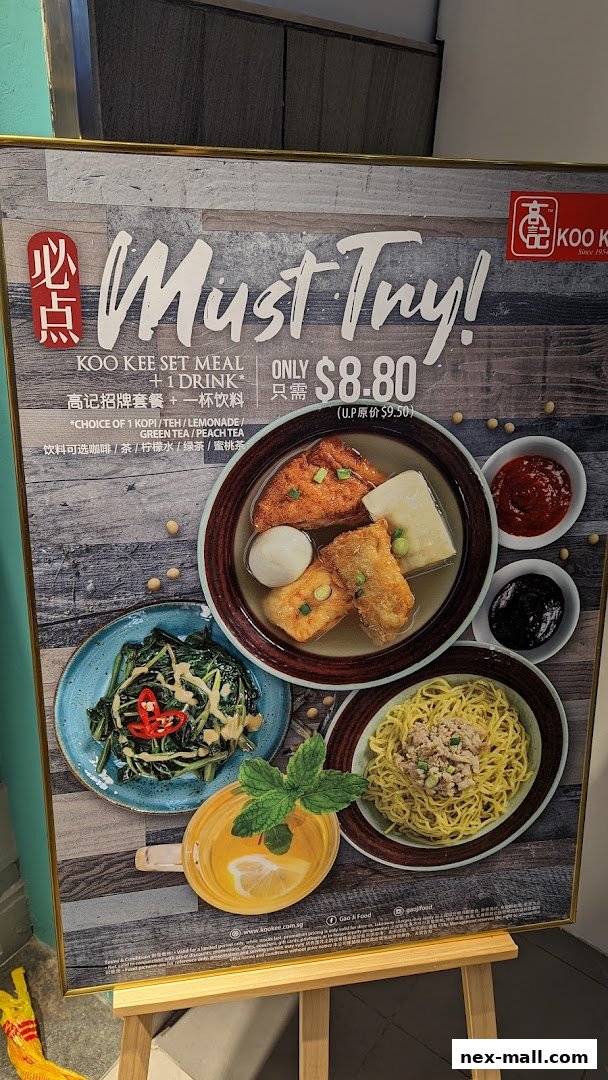 A promotional sign for Koo Kee's set meal with a drink for $8.80.