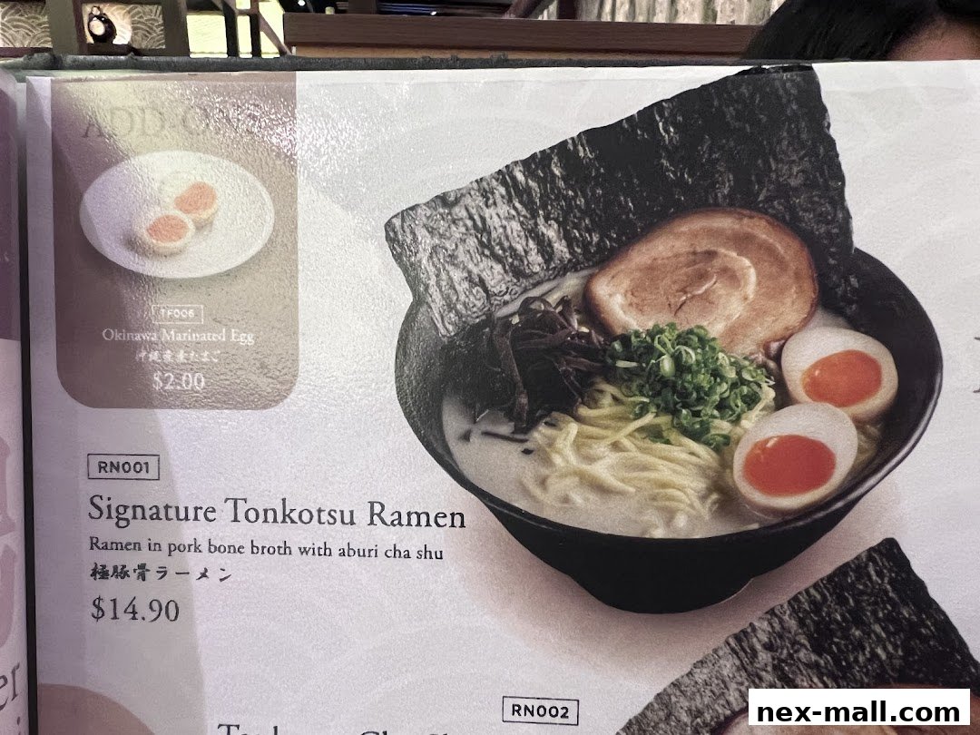 A menu featuring Signature Tonkotsu Ramen and Okinawa Marinated Egg.