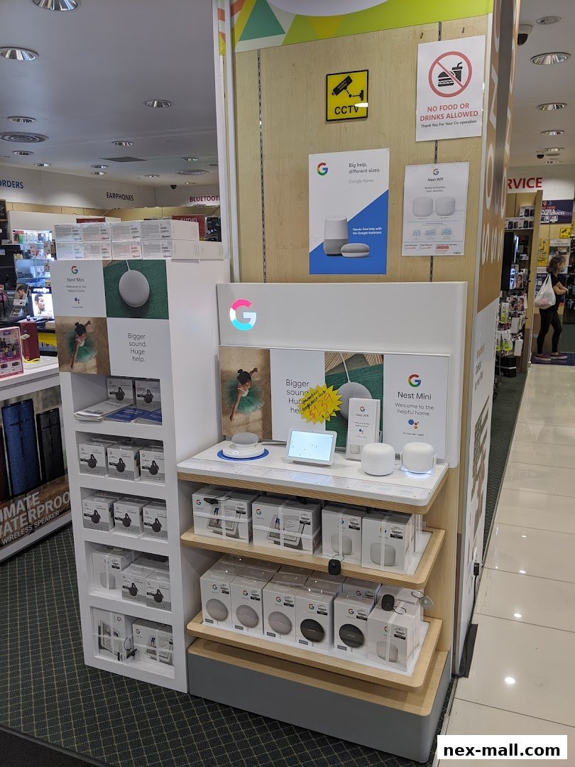 A display of Google Nest products, including Nest Mini and Google Home devices.
