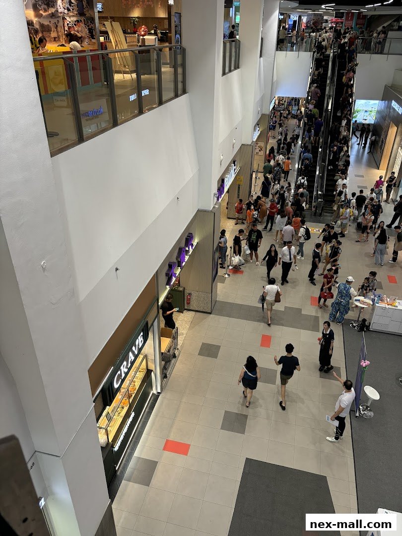 A view of the Crave Nasi Lemak shop entrance and display counter in a busy mall.