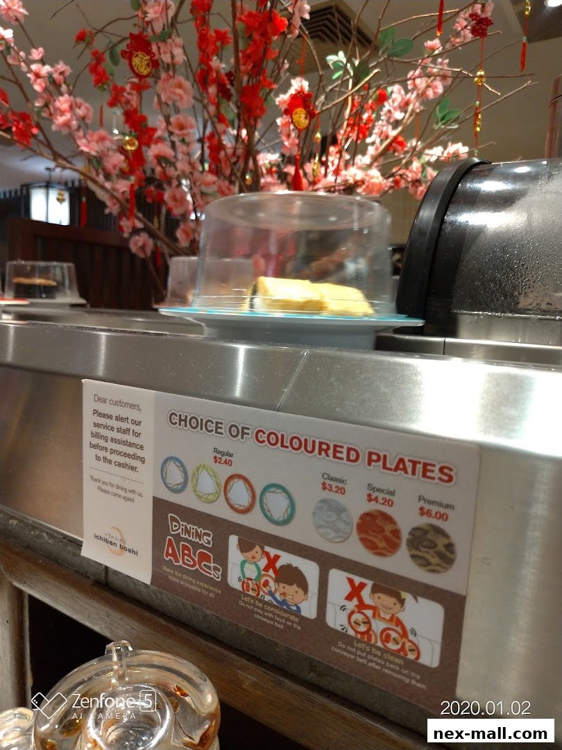 A sign detailing the choice of colored plates and dining etiquette at Ichiban Boshi.