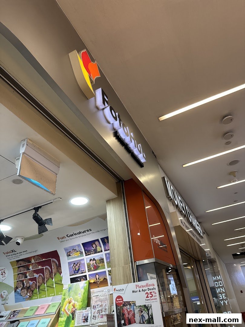 The exterior of a FotoHub shop with signage and promotional displays.