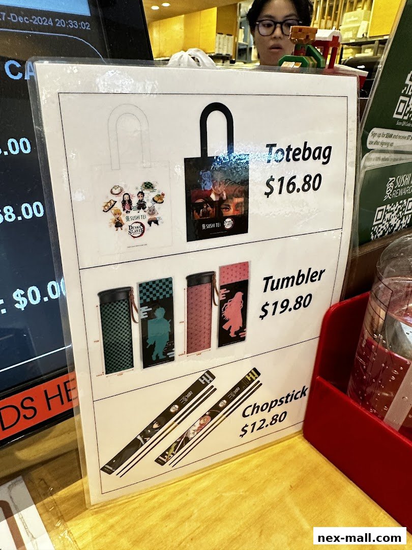 A display of merchandise including tote bags, tumblers, and chopsticks with anime designs.