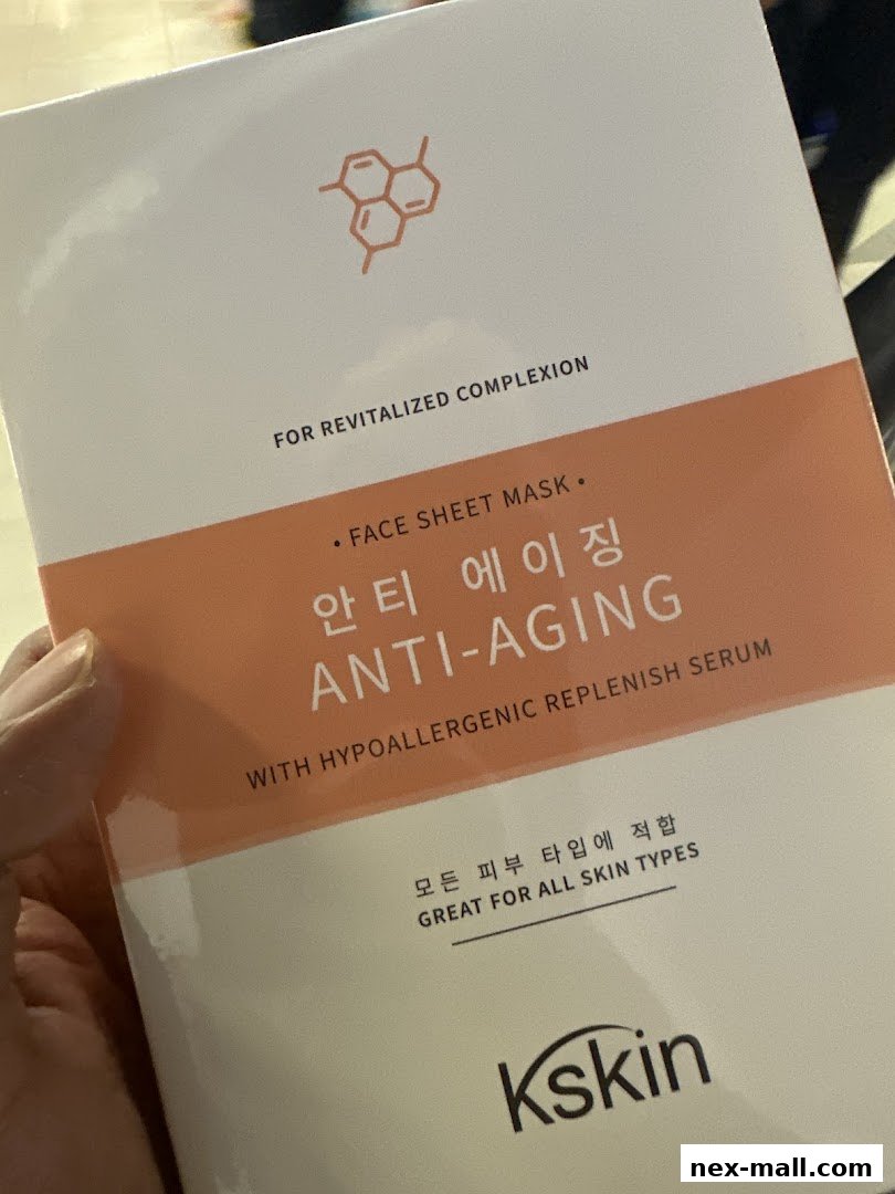 A hand holds a Kskin Anti-Aging Face Sheet Mask with Korean and English text.