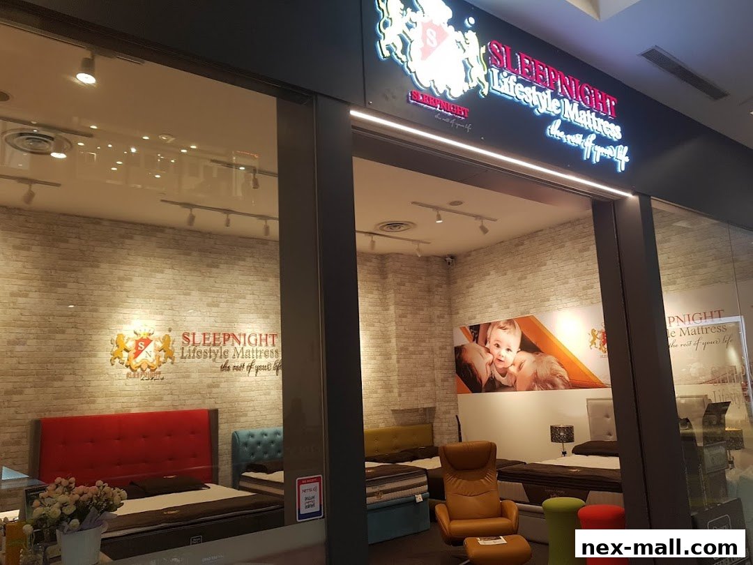 The SLEEPNIGHT Lifestyle Mattress store features beds, mattresses, and seating, with a prominent brand sign.