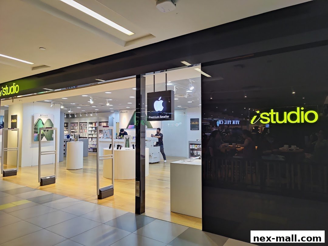 The entrance to an iStudio store, a premium Apple reseller, showcasing Apple products.