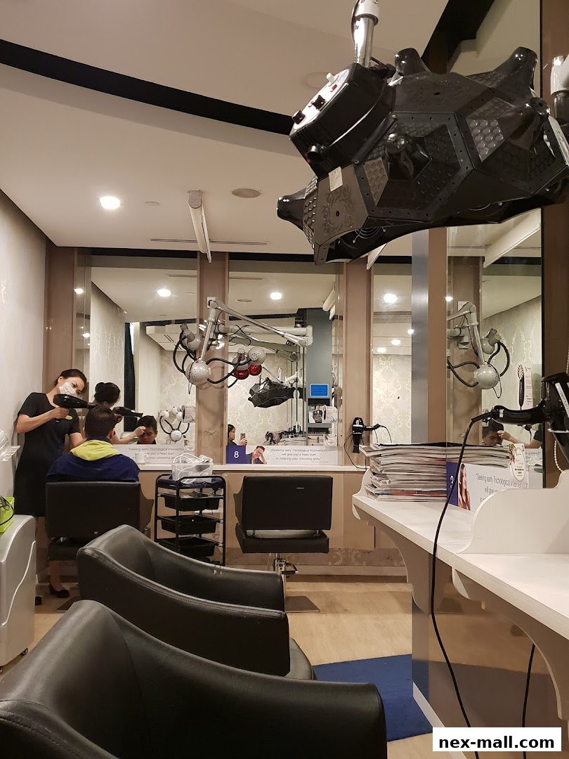 Interior of a hair treatment salon with clients receiving services and specialized equipment.