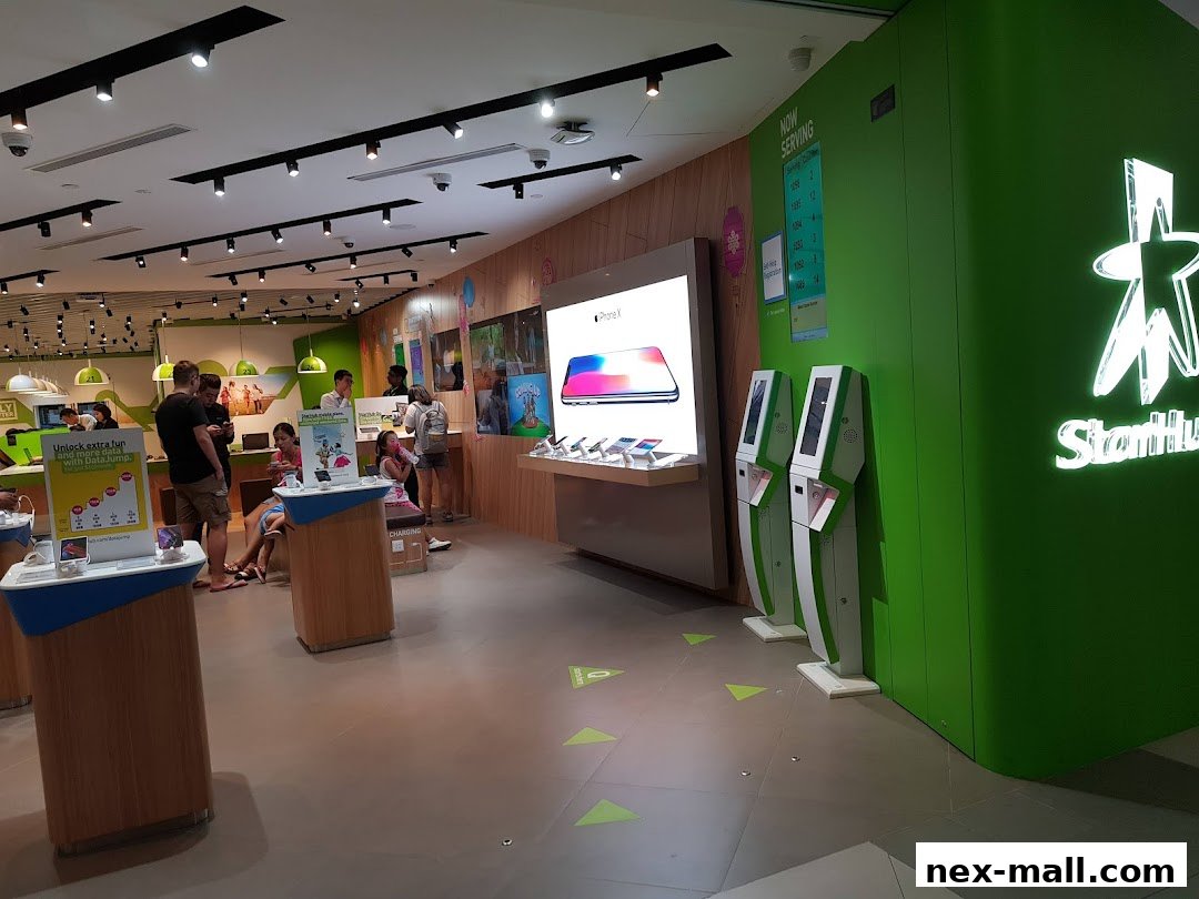 Interior of a StarHub store with customers and product displays.