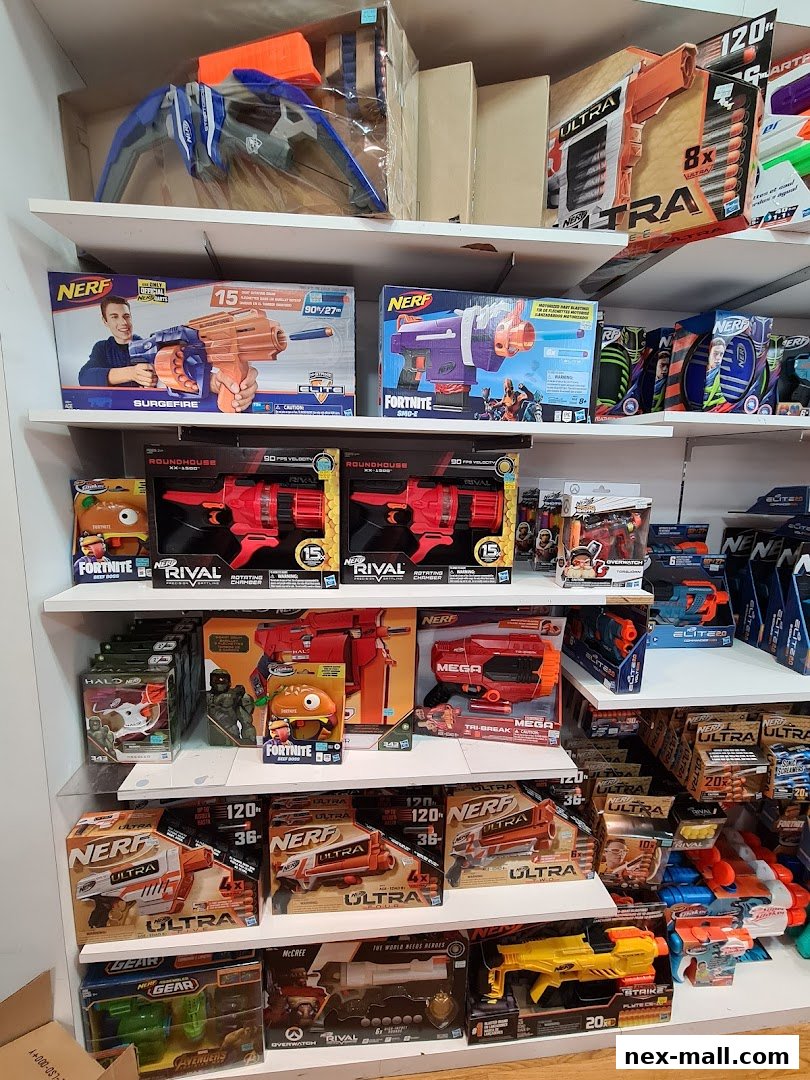 Shelves stocked with various Nerf blasters, including Rival and Ultra series, and Fortnite themed toys.
