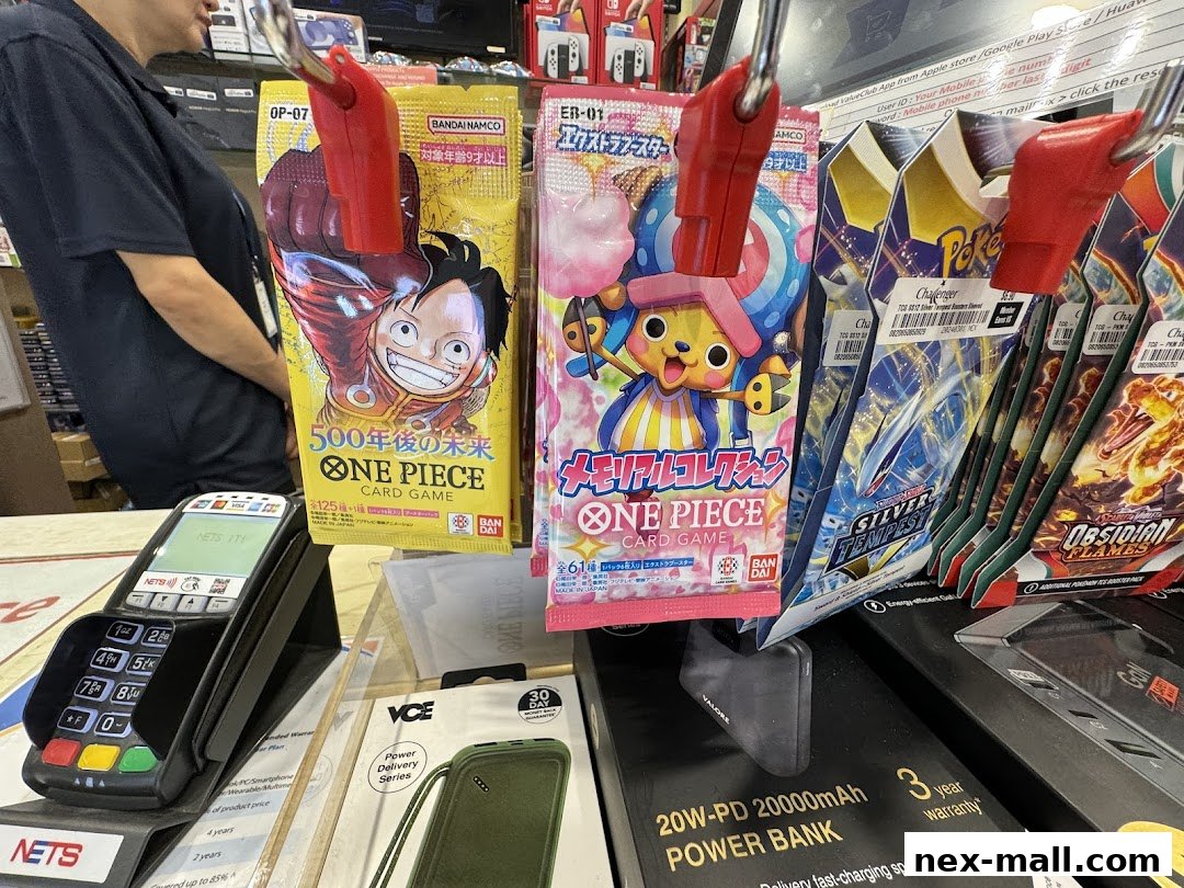 A display of collectible card game packs and power banks at Challenger NEX.