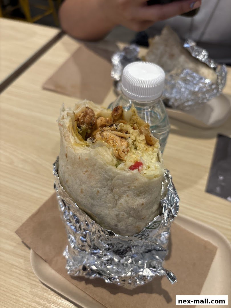 A close-up of a delicious burrito from Guzman y Gomez, ready to be enjoyed.