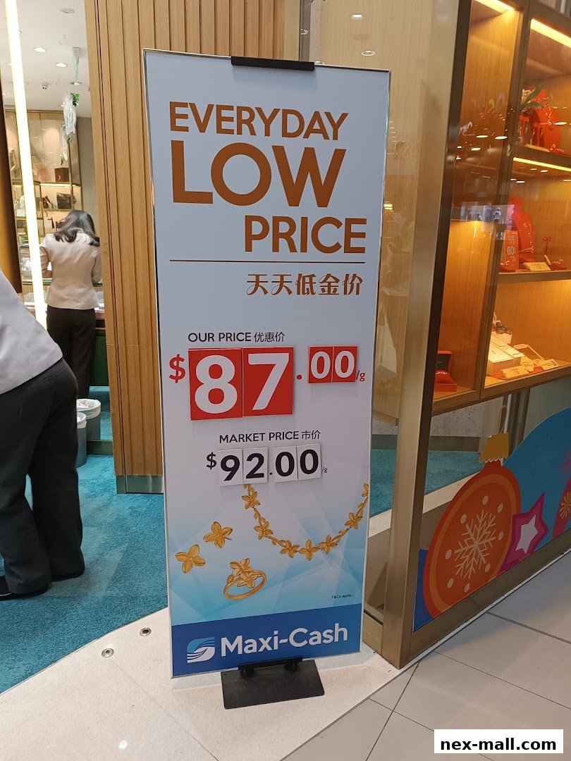 A sign advertising everyday low prices for gold jewelry at Maxi-Cash.