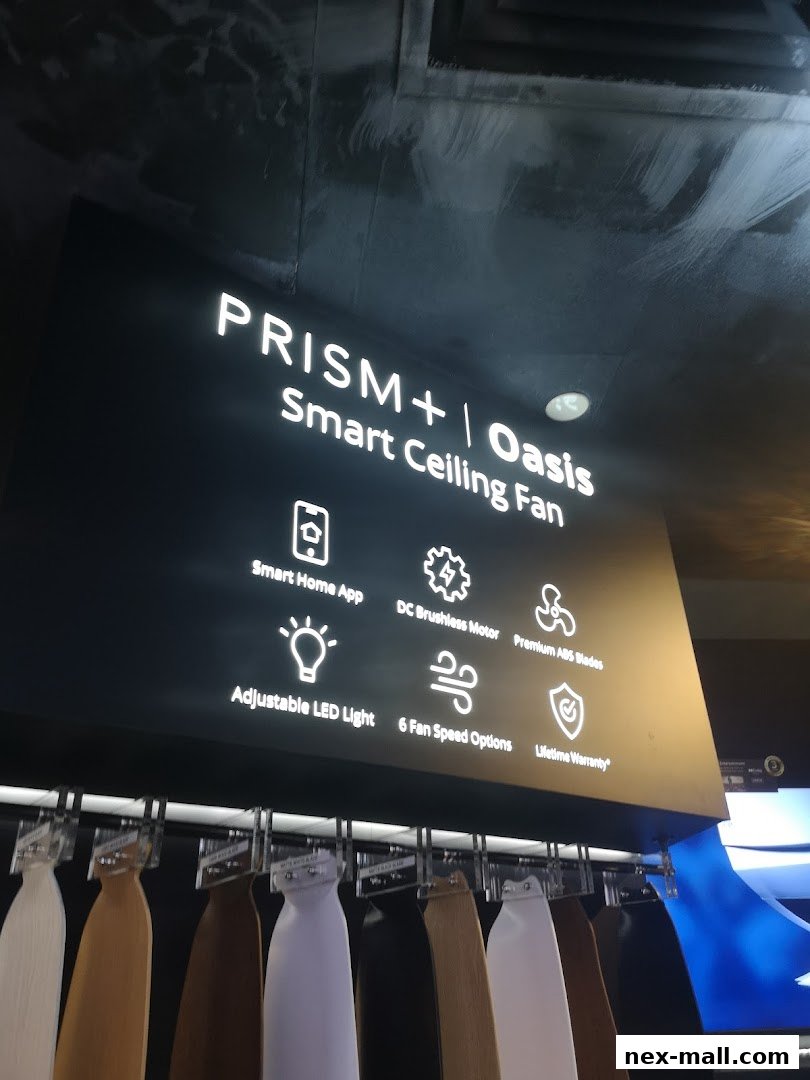 A display of PRISM+ Oasis Smart Ceiling Fans with various blade colors and features listed.