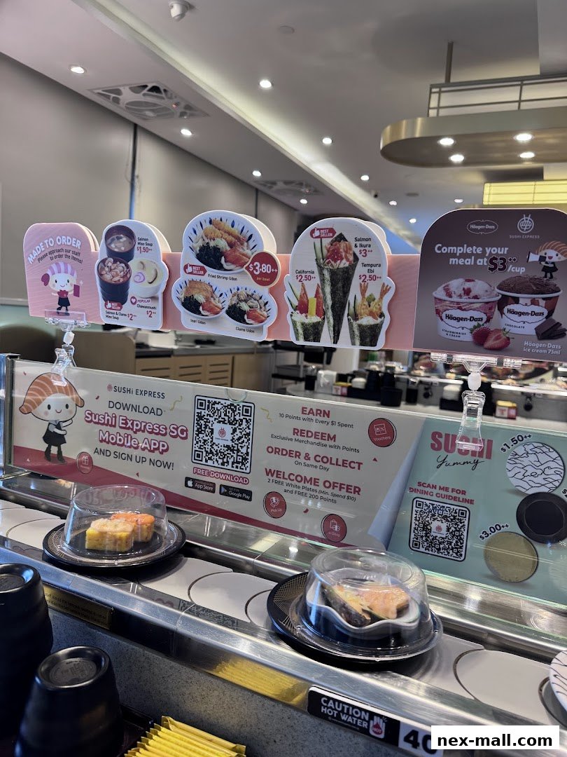 Sushi dishes and desserts displayed on a conveyor belt at Sushi Express.