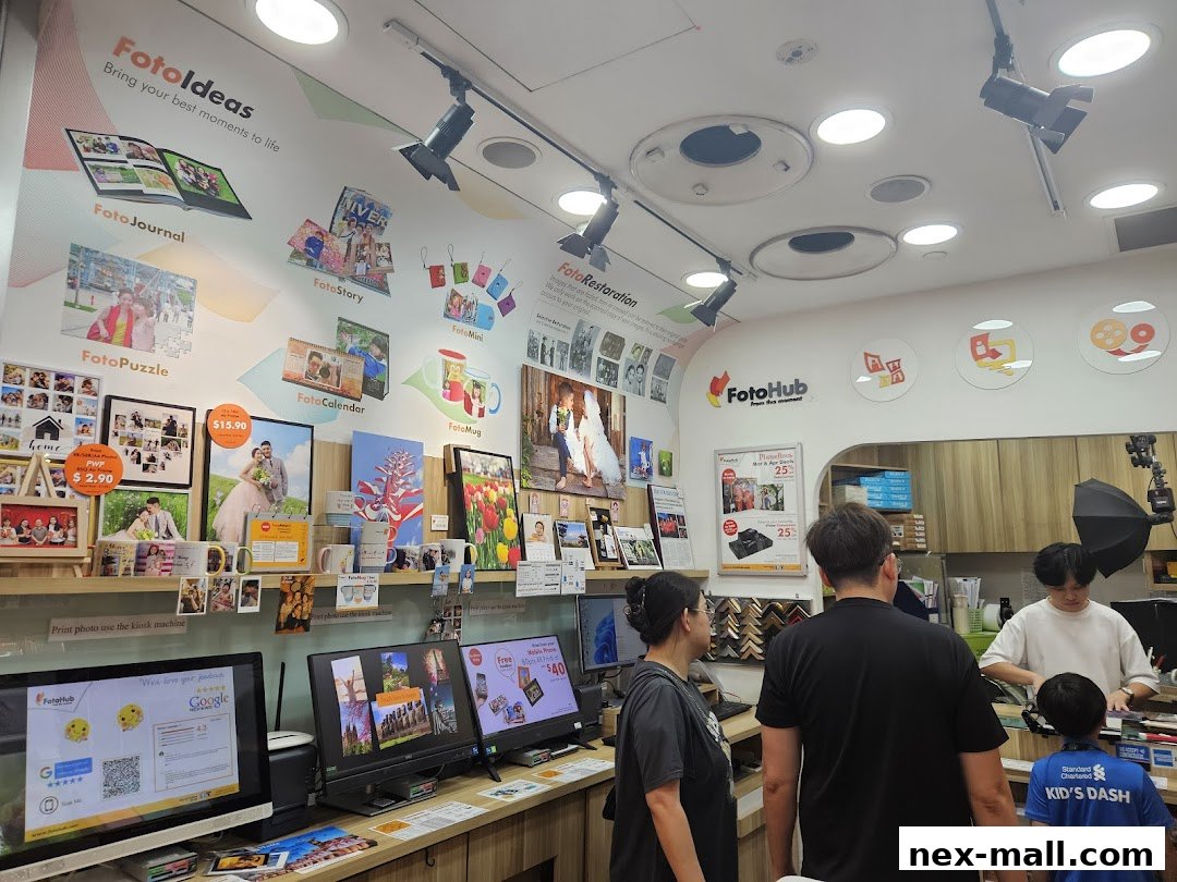 Interior of a FotoHub store showcasing photo printing services and products.