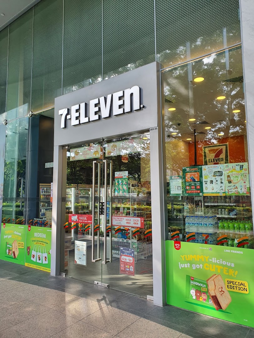 The image shows the brightly lit exterior and entrance of a 7-Eleven convenience store.