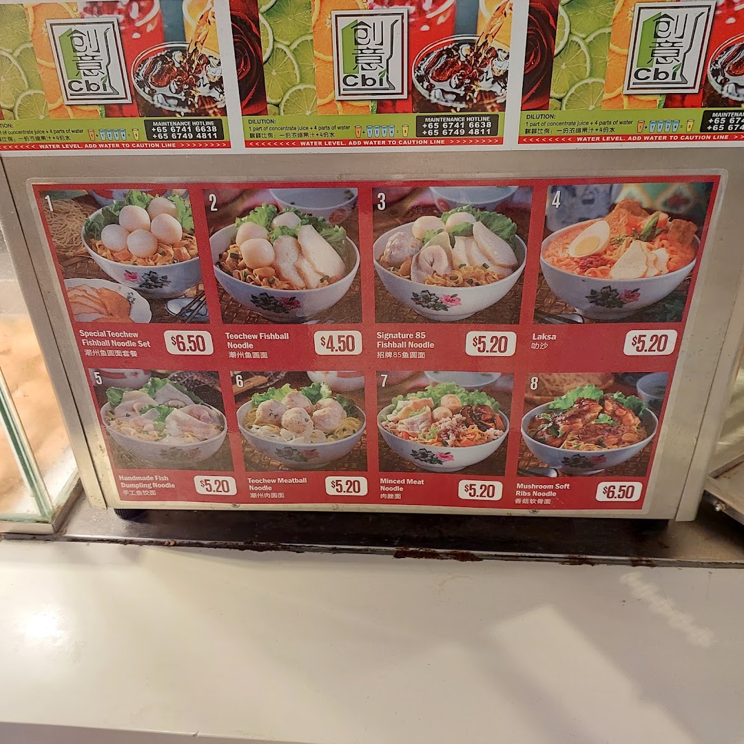 A vibrant menu board showcasing various Teochew noodle dishes with prices and images.
