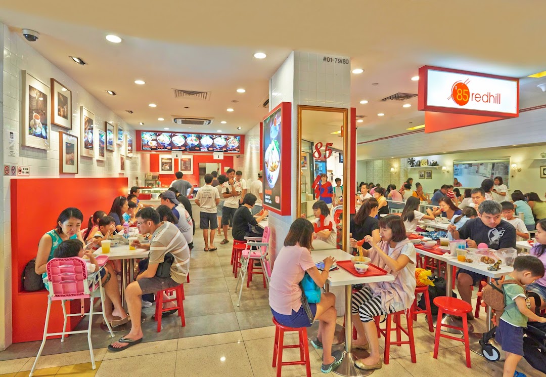 A bustling interior view of 85 Redhill Teochew Fishball Noodle, filled with diners enjoying their meals.