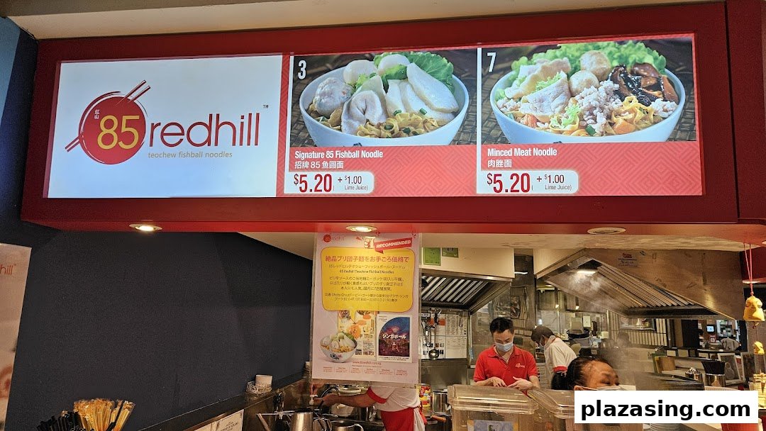 A digital menu board displaying Signature Fishball Noodle and Minced Meat Noodle with prices at 85 Redhill.