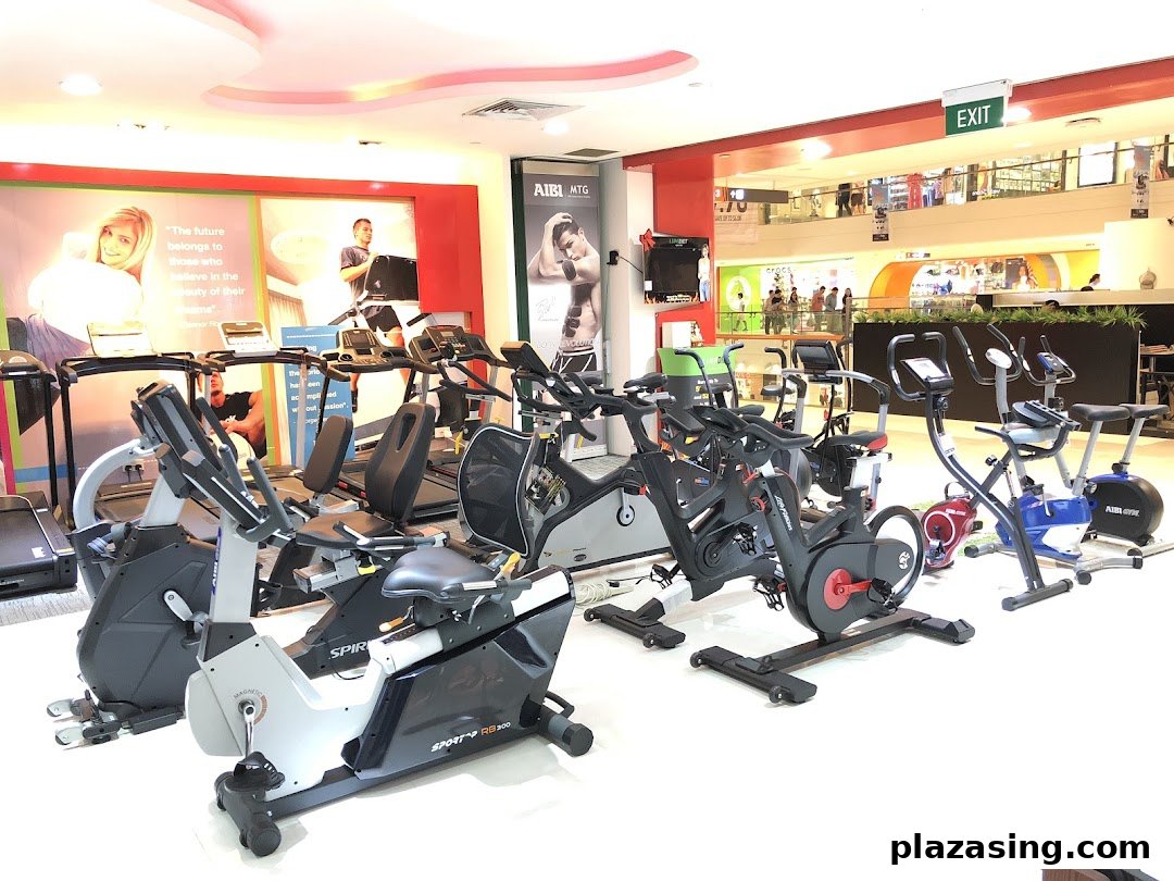 A wide view of Aibi store interior showcasing various fitness equipment like treadmills and exercise bikes.