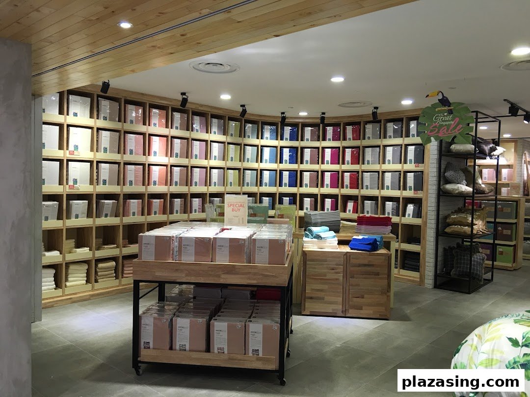 Interior view of AKEMI store showcasing a wide array of neatly displayed bedding and home linen products.