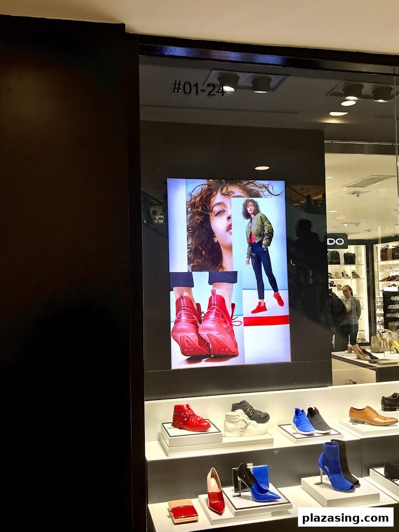 ALDO Plaza Singapura's shop front display features stylish footwear and accessories, with a large digital screen.