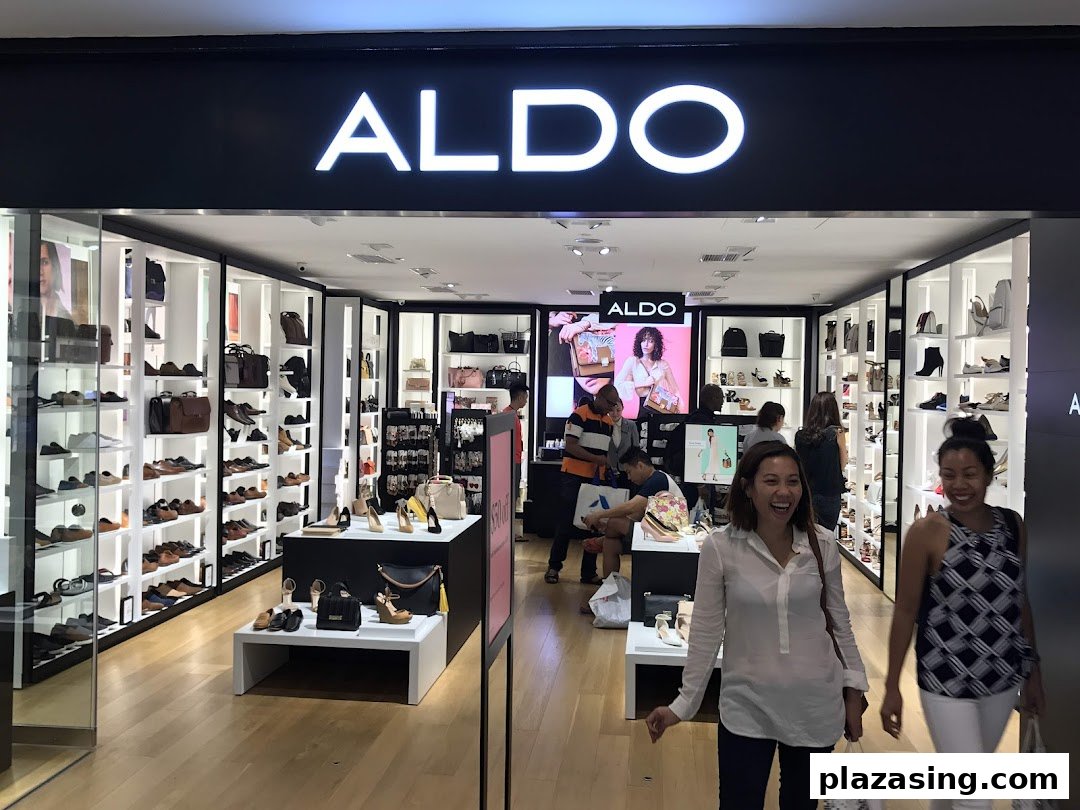 The brightly lit ALDO shop front showcases shoes and bags, with customers entering and browsing.