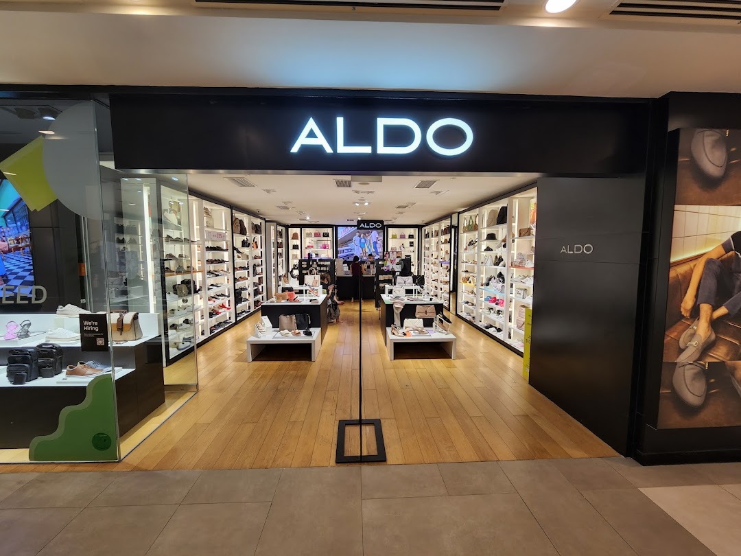 The brightly lit entrance of the ALDO shoe and accessories store, showcasing its interior.