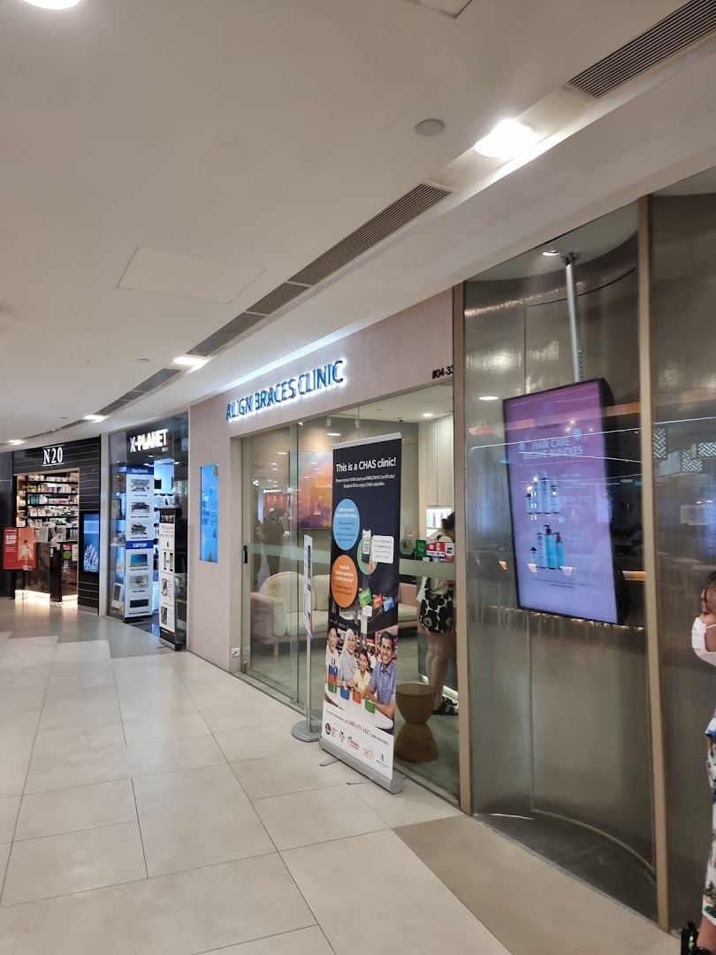 The exterior of Align Braces Clinic in a shopping mall, featuring its entrance and signage.