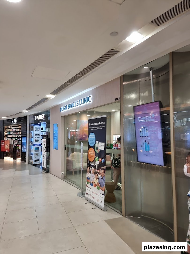 The exterior of Align Braces Clinic in a shopping mall, featuring its entrance and signage.