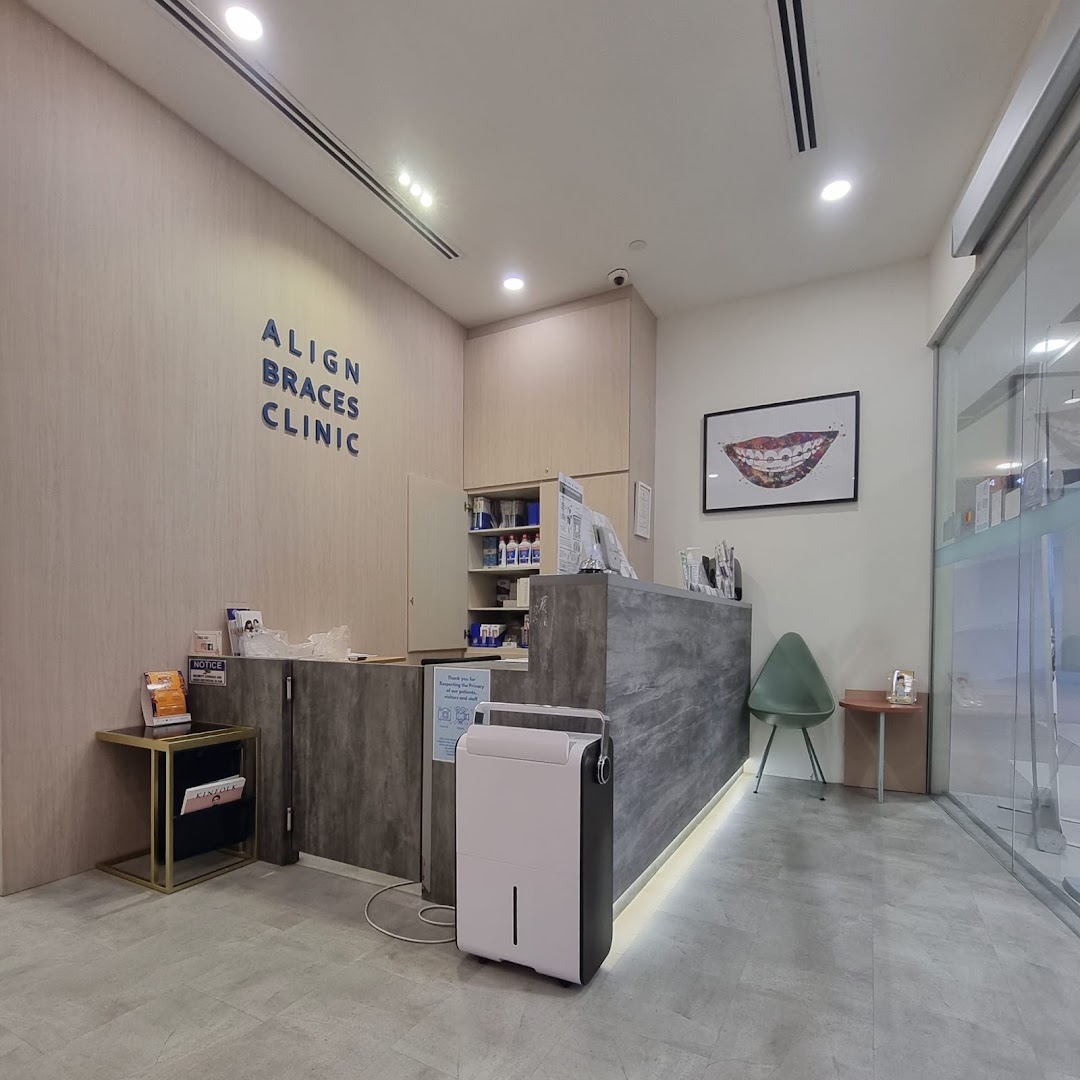 The reception area of Align Braces Clinic, featuring a modern counter, waiting space, and clinic branding.