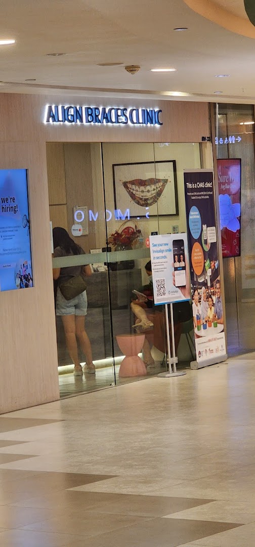 Exterior view of Align Braces Clinic with glass entrance and promotional displays.