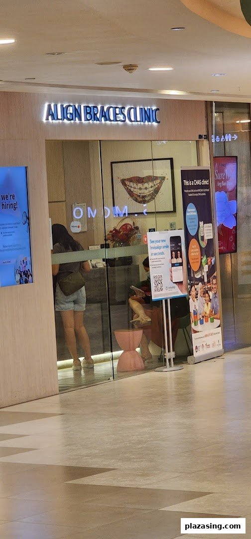 Exterior view of Align Braces Clinic with glass entrance and promotional displays.