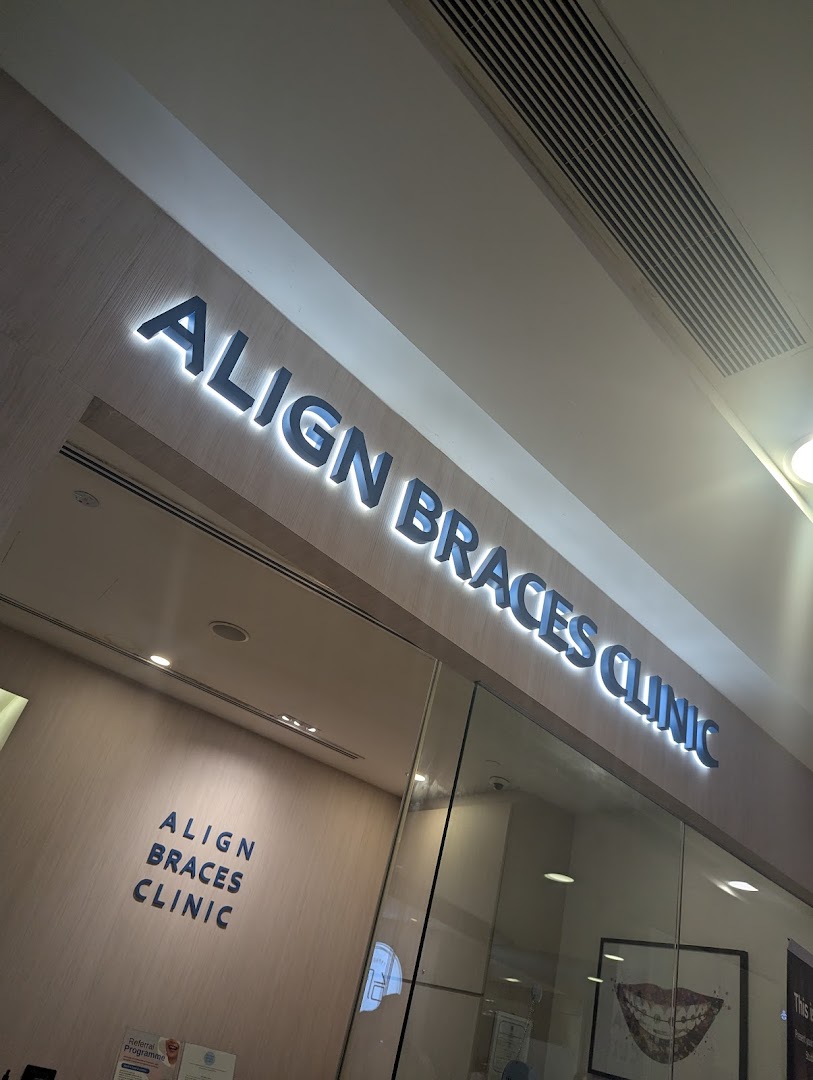 The illuminated exterior signage of Align Braces Clinic at Plaza Singapura.
