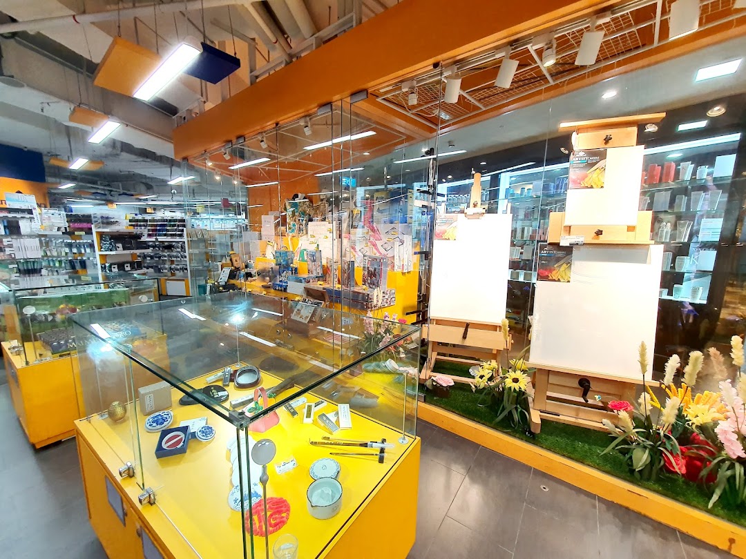 An interior view of Art Friend, showcasing art supplies, easels, canvases, and display cases with various creative tools.