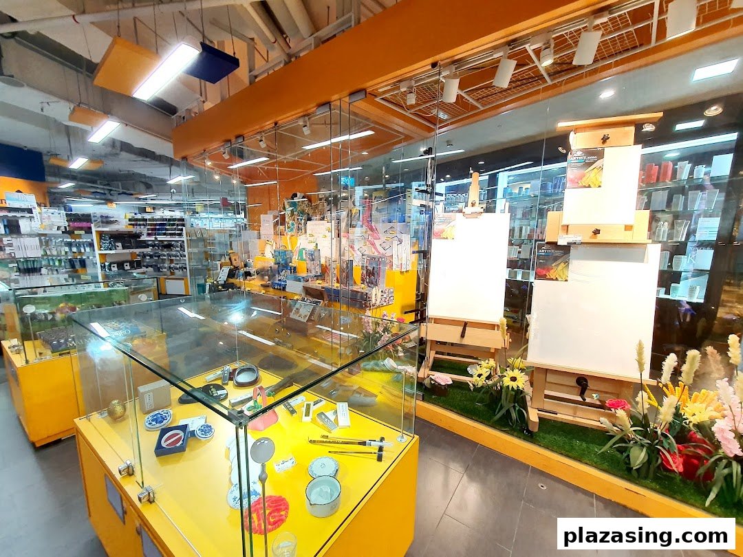 An interior view of Art Friend, showcasing art supplies, easels, canvases, and display cases with various creative tools.