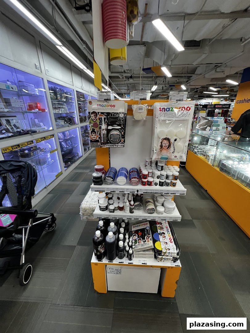 An aisle inside Art Friend showcasing Snazaroo face paints and various art supplies in display cases.