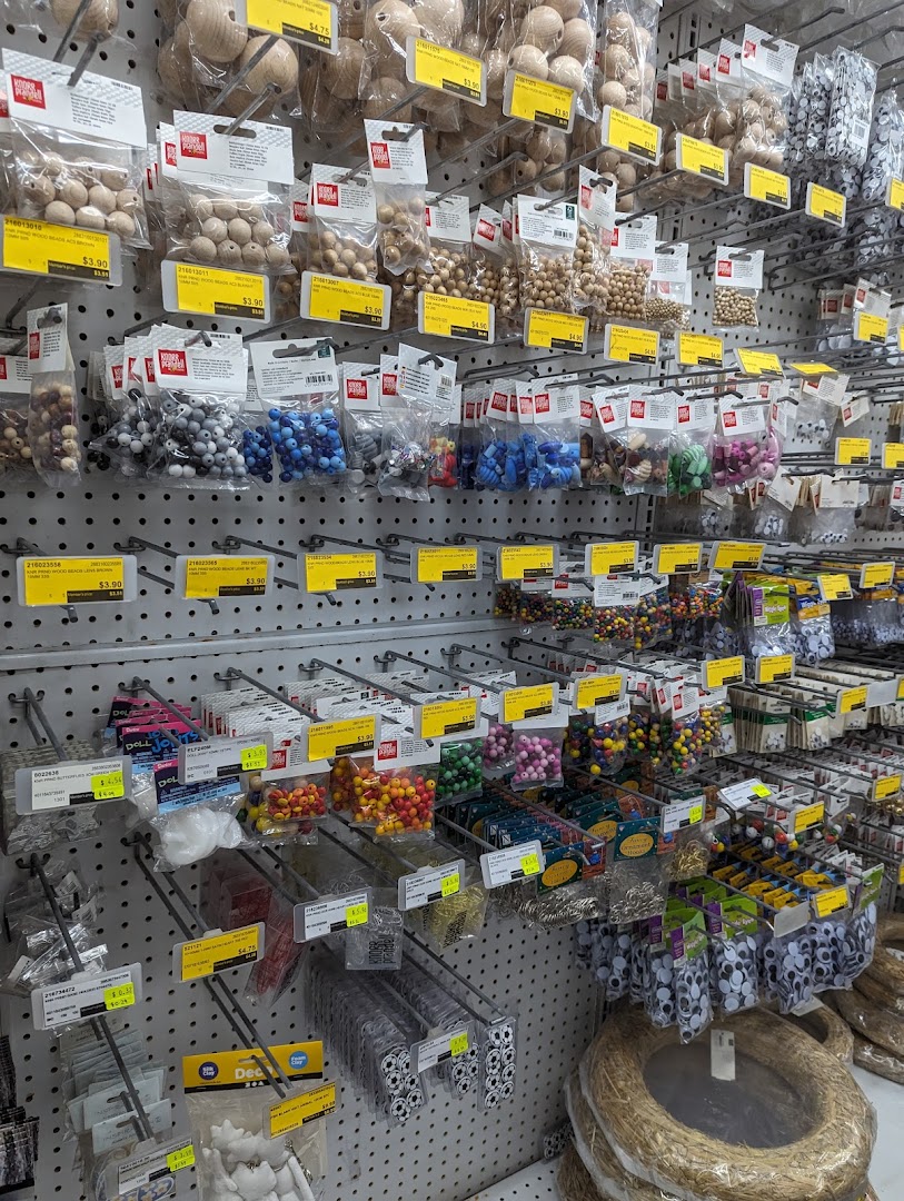 Shelves at Art Friend display a wide variety of craft beads, googly eyes, and other small art and hobby supplies.