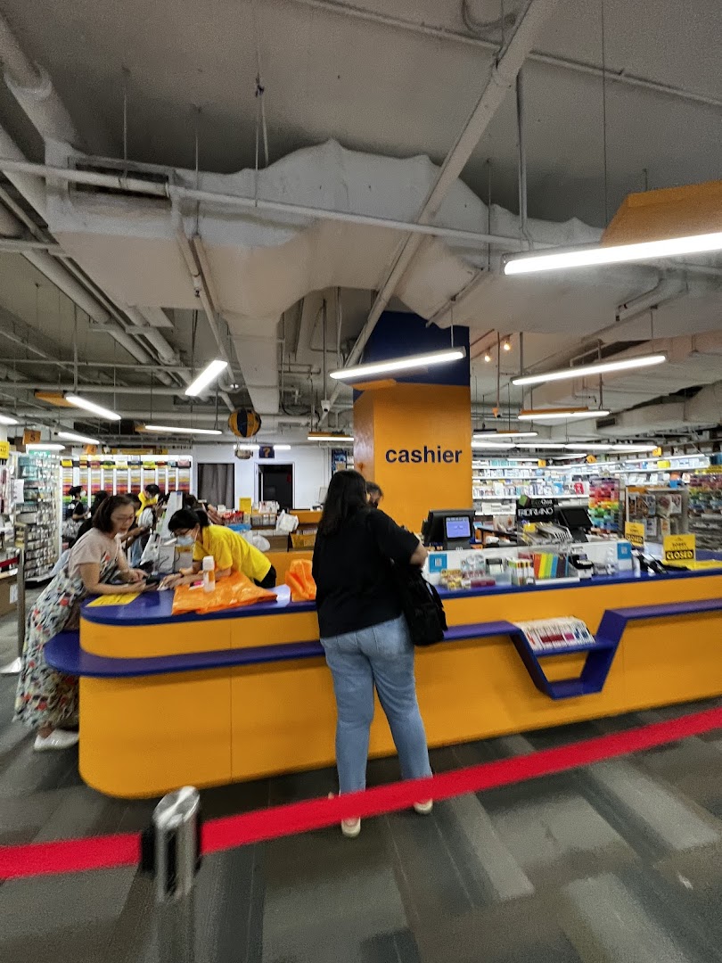 Customers and staff at the cashier counter inside an Art Friend art supply store.