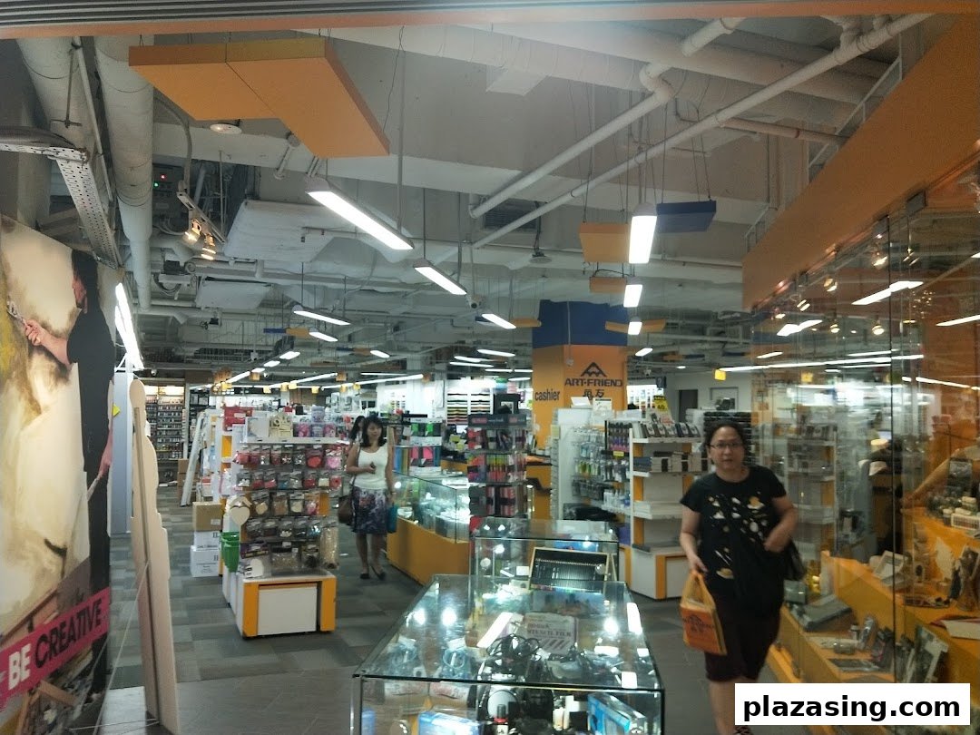 An interior view of Art Friend, an art supply store, showcasing aisles of products and customers browsing.