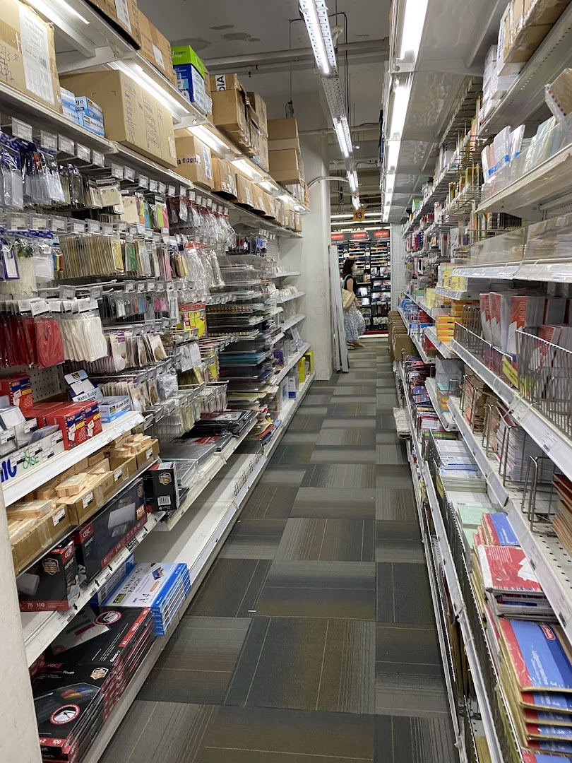 A long aisle inside Art Friend, showcasing shelves packed with various art and stationery supplies.