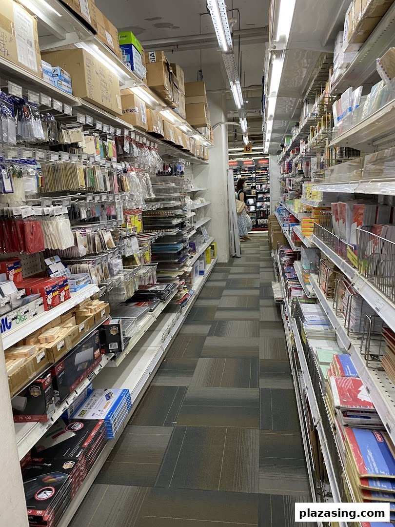 A long aisle inside Art Friend, showcasing shelves packed with various art and stationery supplies.