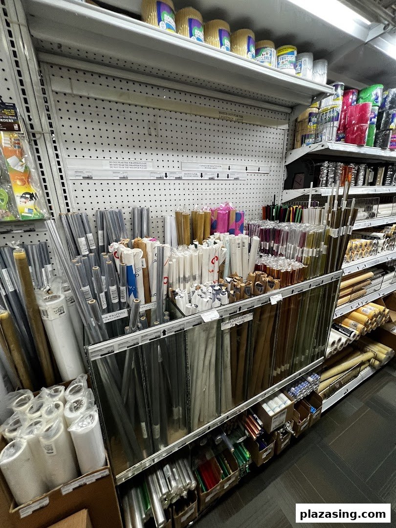 Shelves at Art Friend stocked with a wide variety of art and craft paper rolls and supplies.