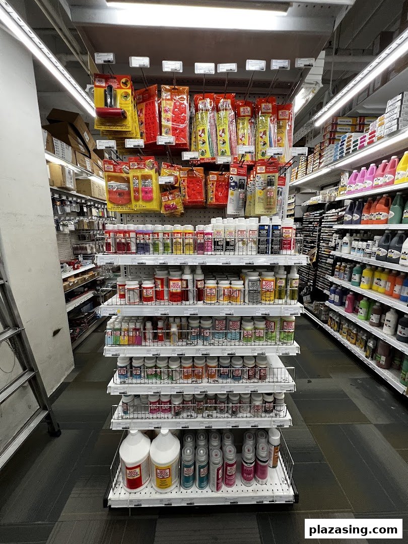 An aisle in Art Friend showcasing a wide array of Mod Podge products, paints, and various art and craft supplies.