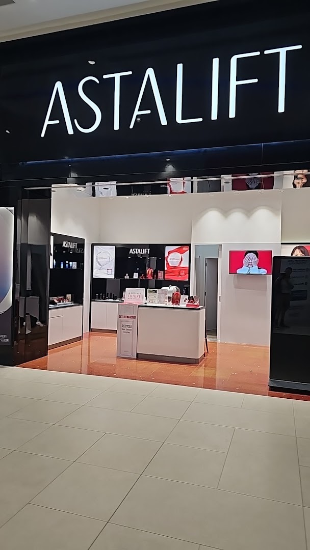The storefront of Astalift, a beauty and skincare shop, showcasing its bright interior and product displays.