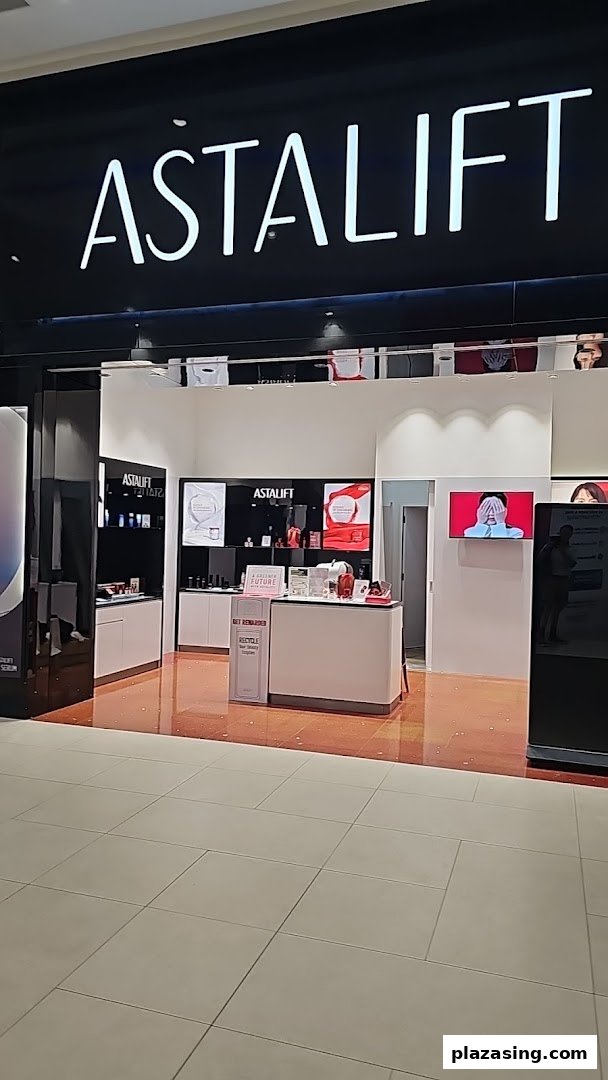The storefront of Astalift, a beauty and skincare shop, showcasing its bright interior and product displays.
